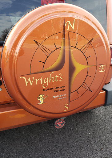 jeep displaying Wright's Automotive Group Sign for Auto Body Services